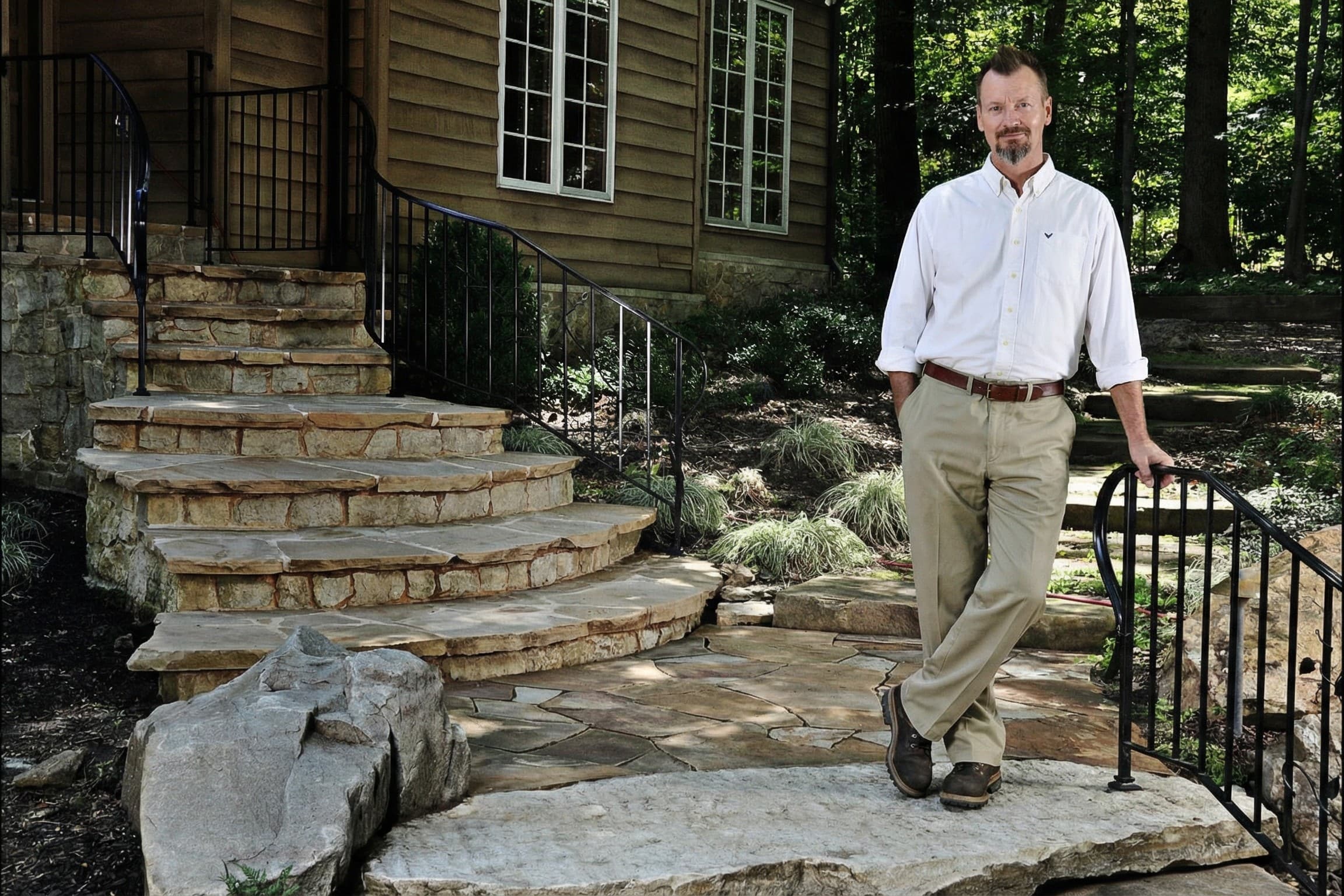 WildWorks natural stone steps and landscape with the artist standing beside the work