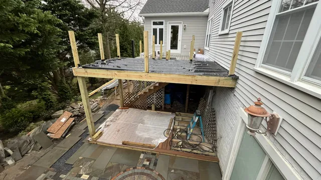 Project Wildfire construction field photo 61, documenting the outdoor fireplace, patio, lounge, and upper deck build